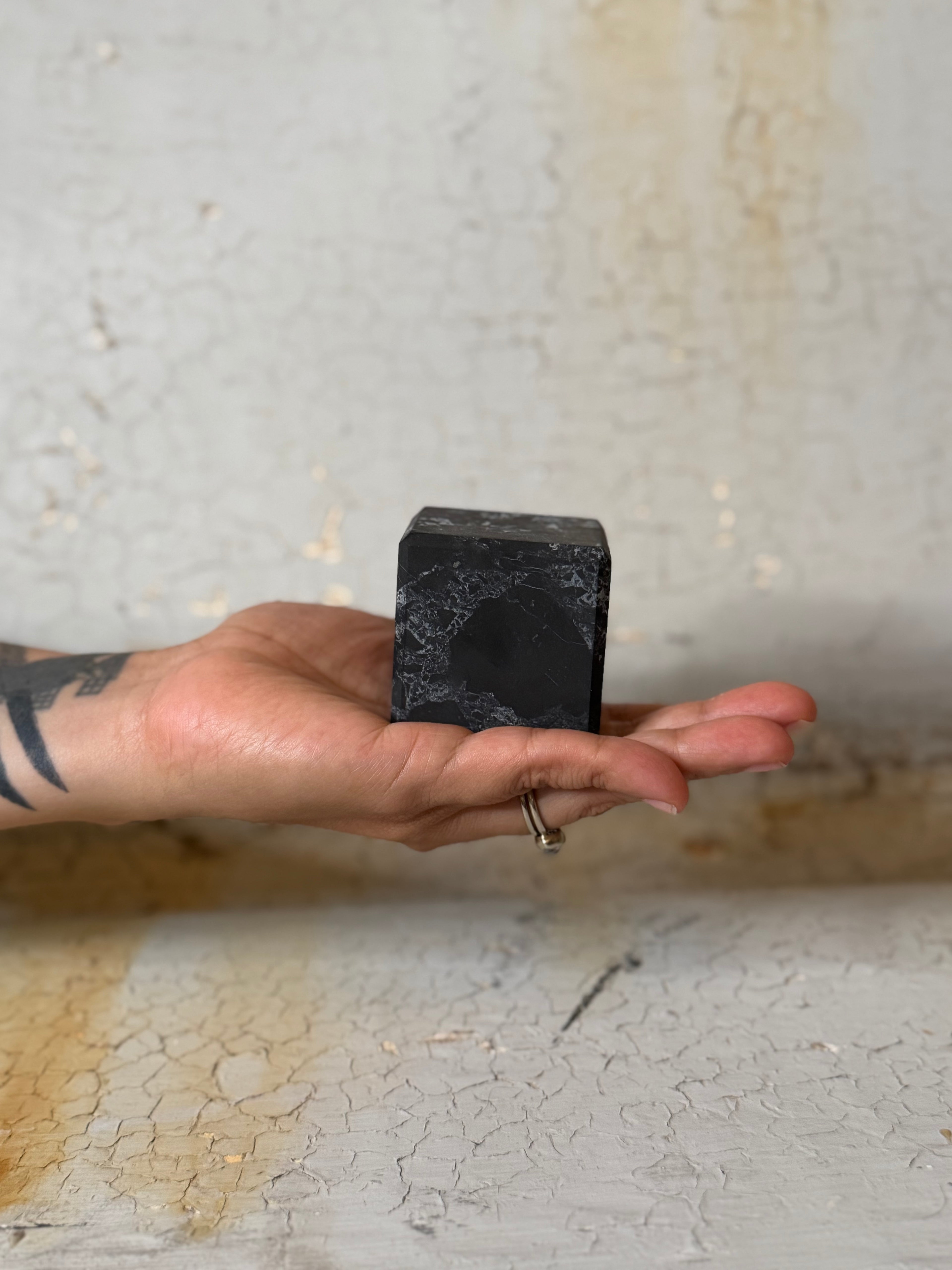 Shungite cube with quartz veins