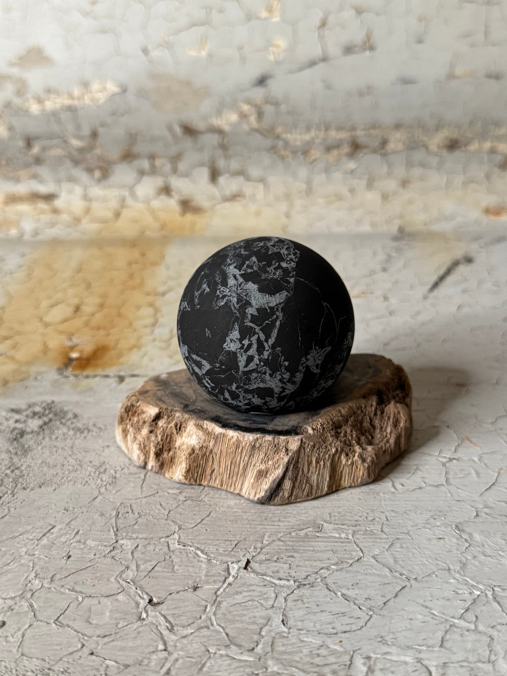 Shungite sphere with quartz veins