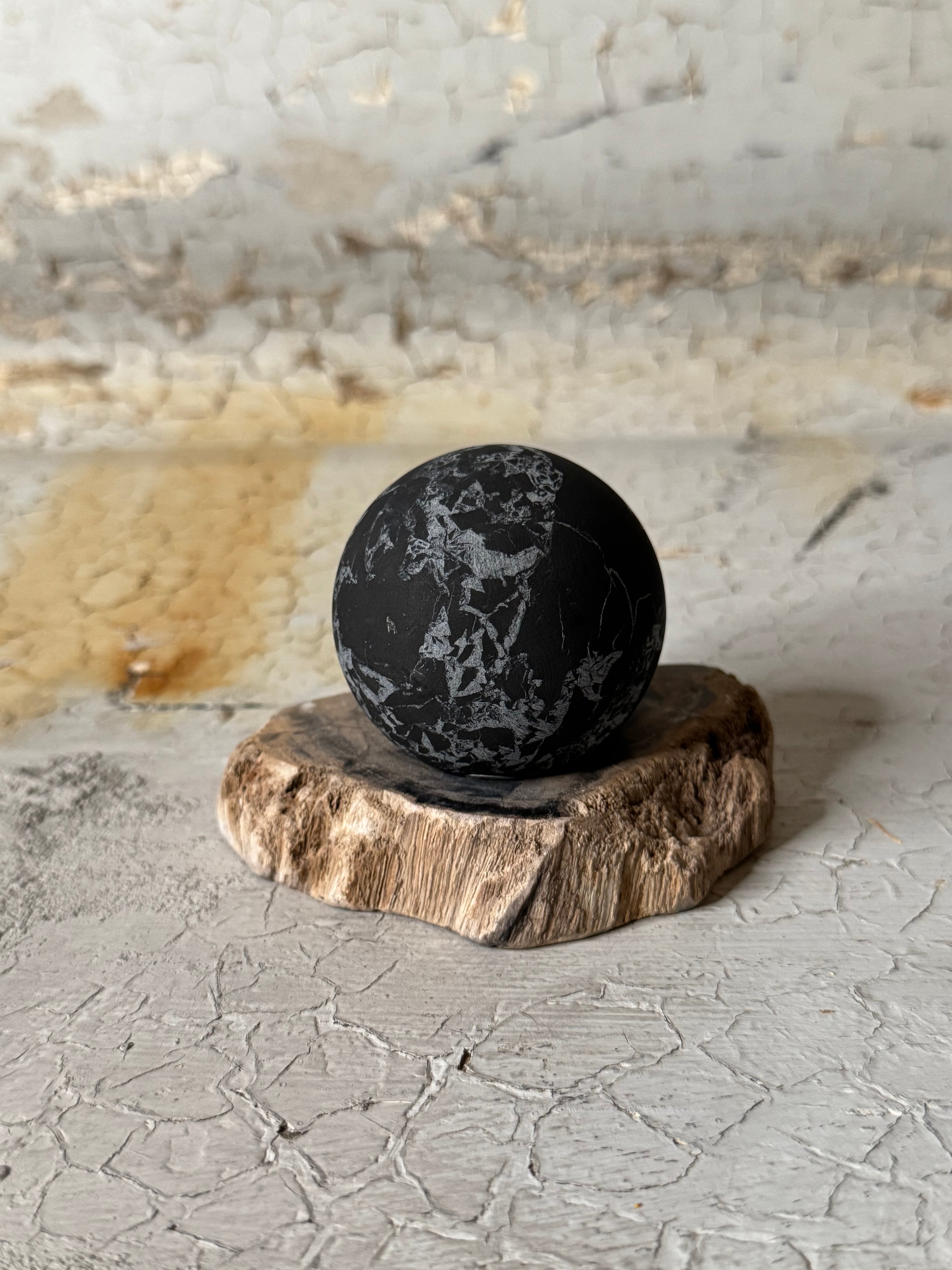 Shungite sphere with quartz veins
