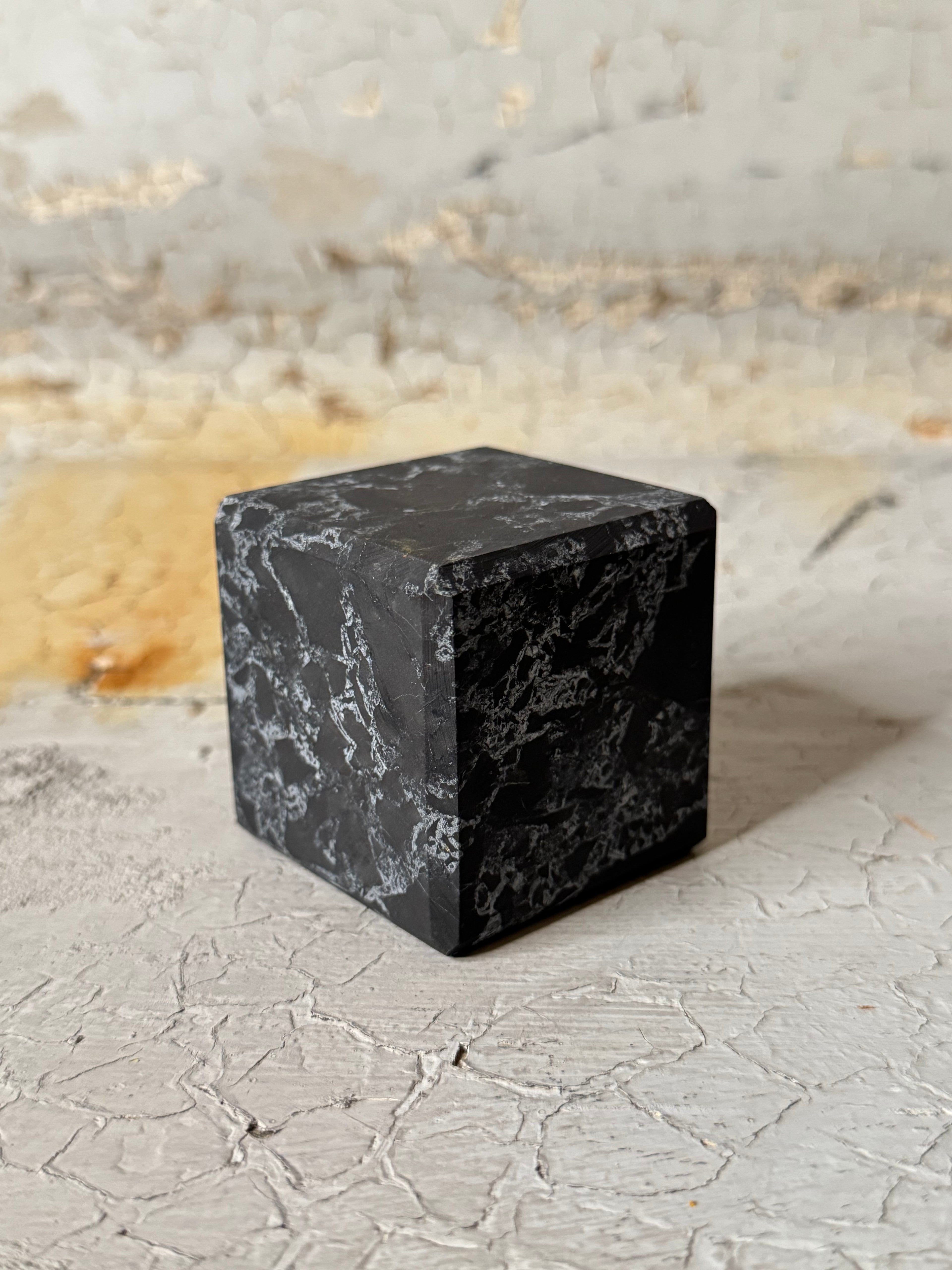 Shungite cube with quartz veins