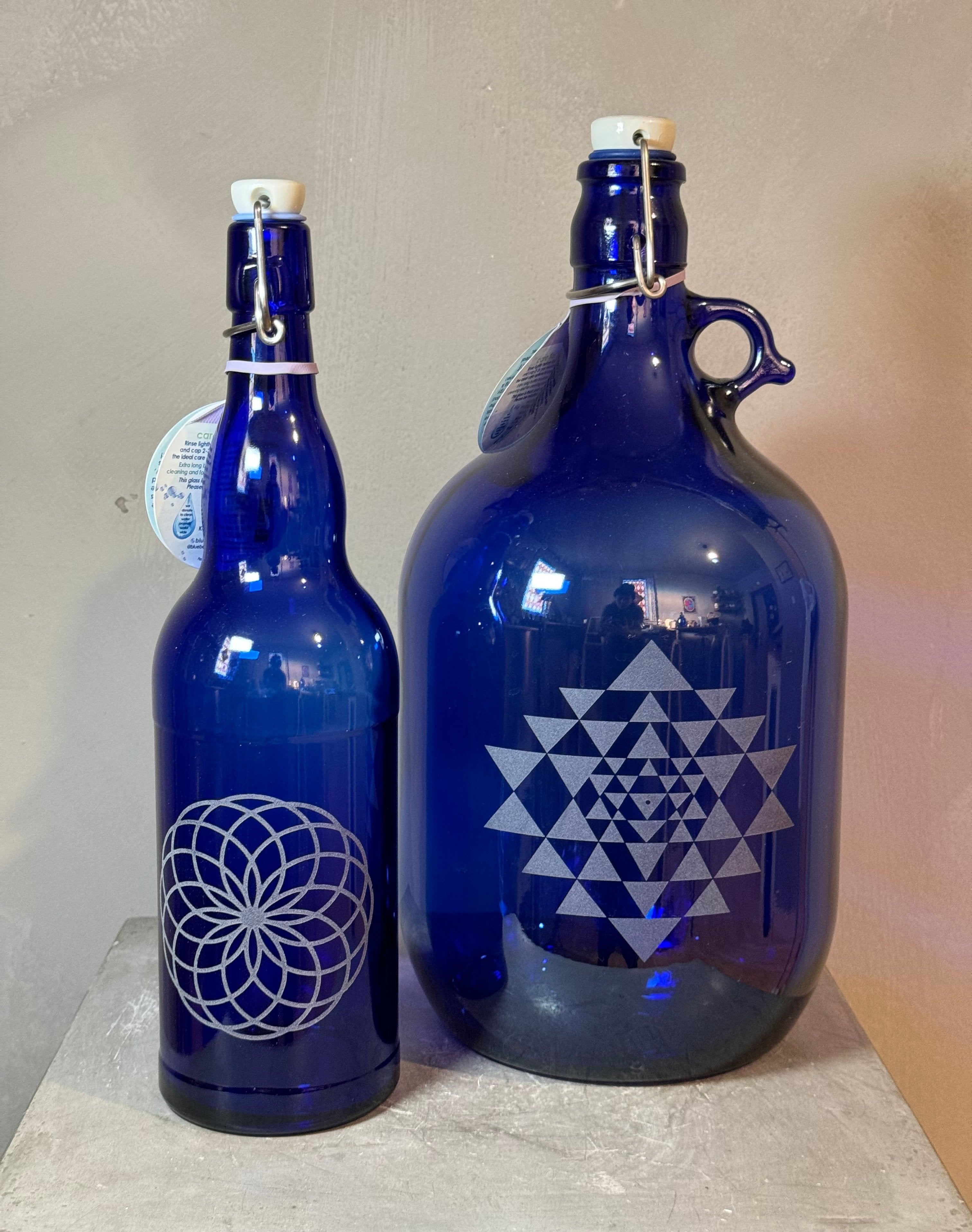 Blue glass bottles with sacred geometry - multiple designs - 2 sizes