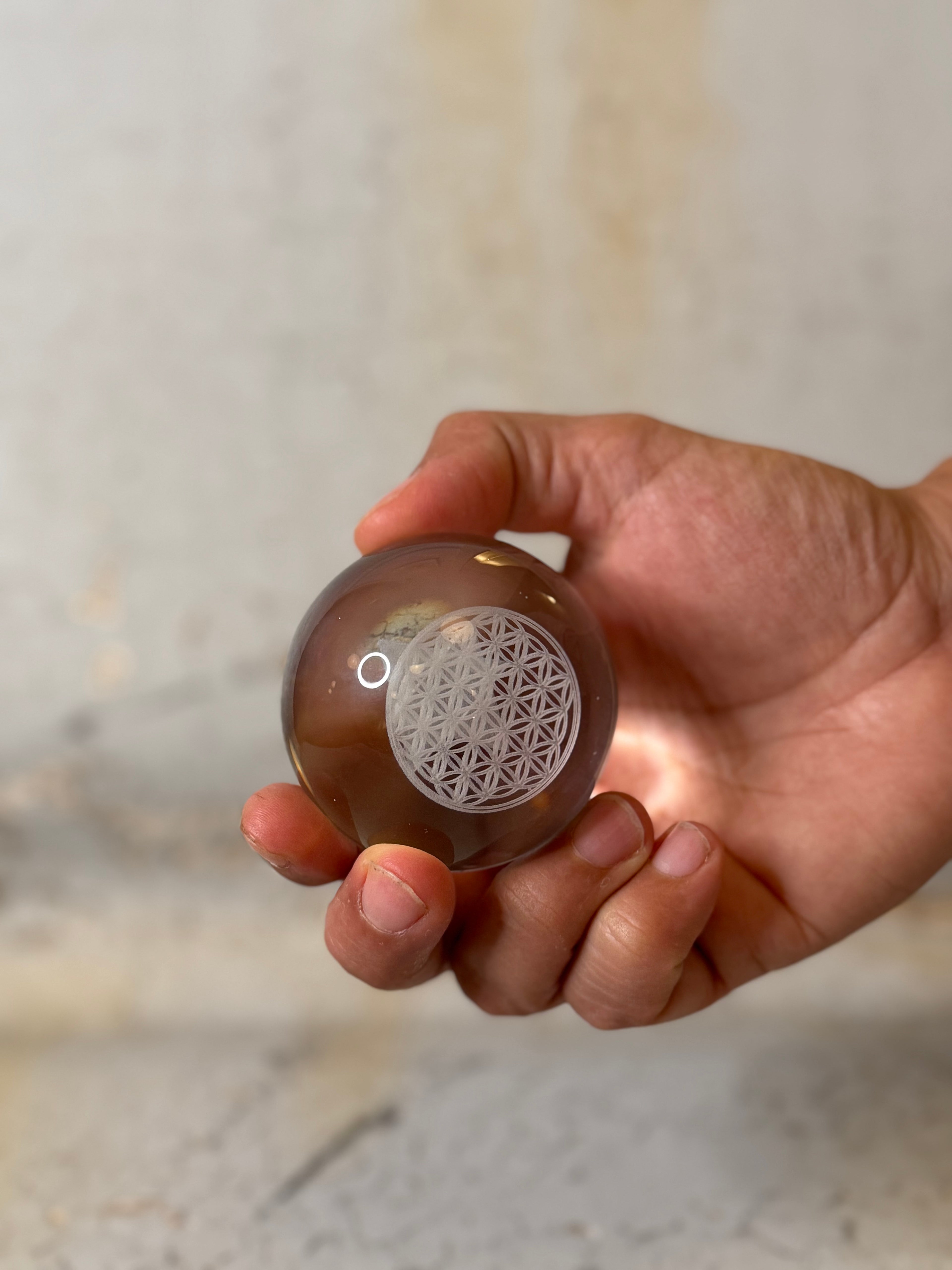 holographic glass sphere with merkaba and flower of life