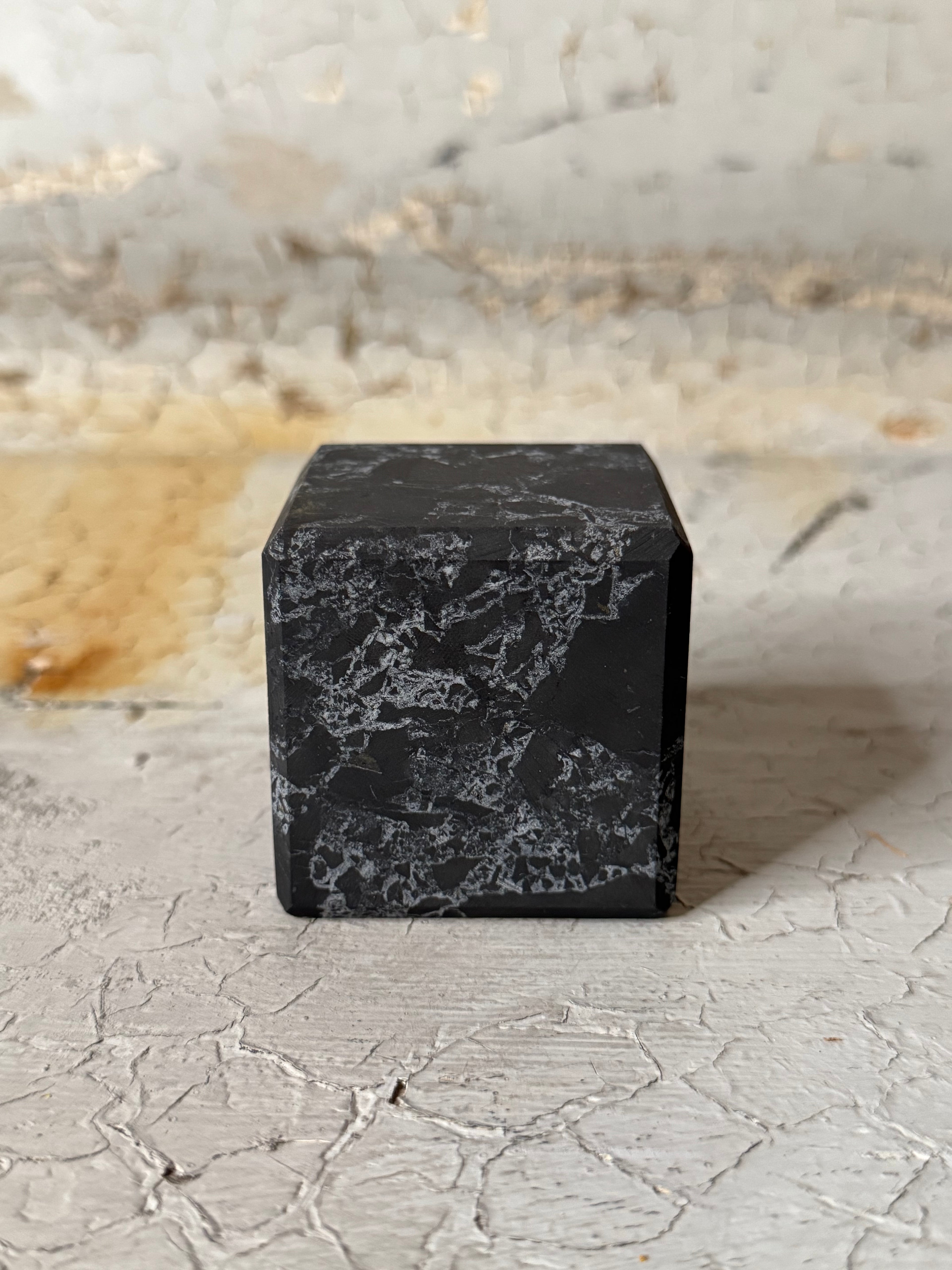 Shungite cube with quartz veins